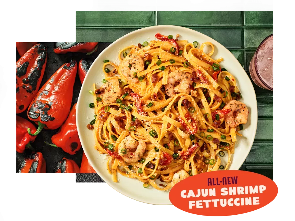 All-new Cajun Shrimp Fettucine on table top with roasted red bell peppers