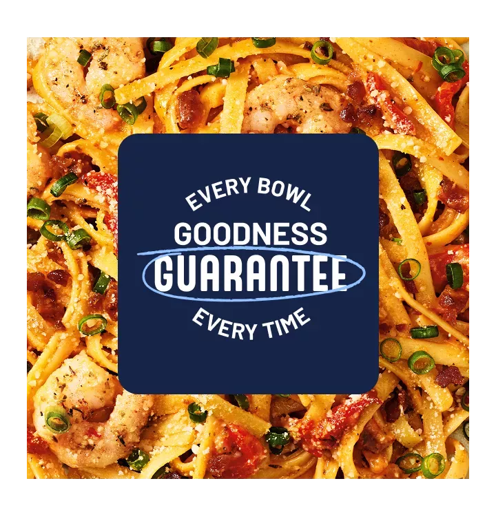 Goodness guarantee. Every bowl, every time. Macro image of Cajun shrimp fettucine.