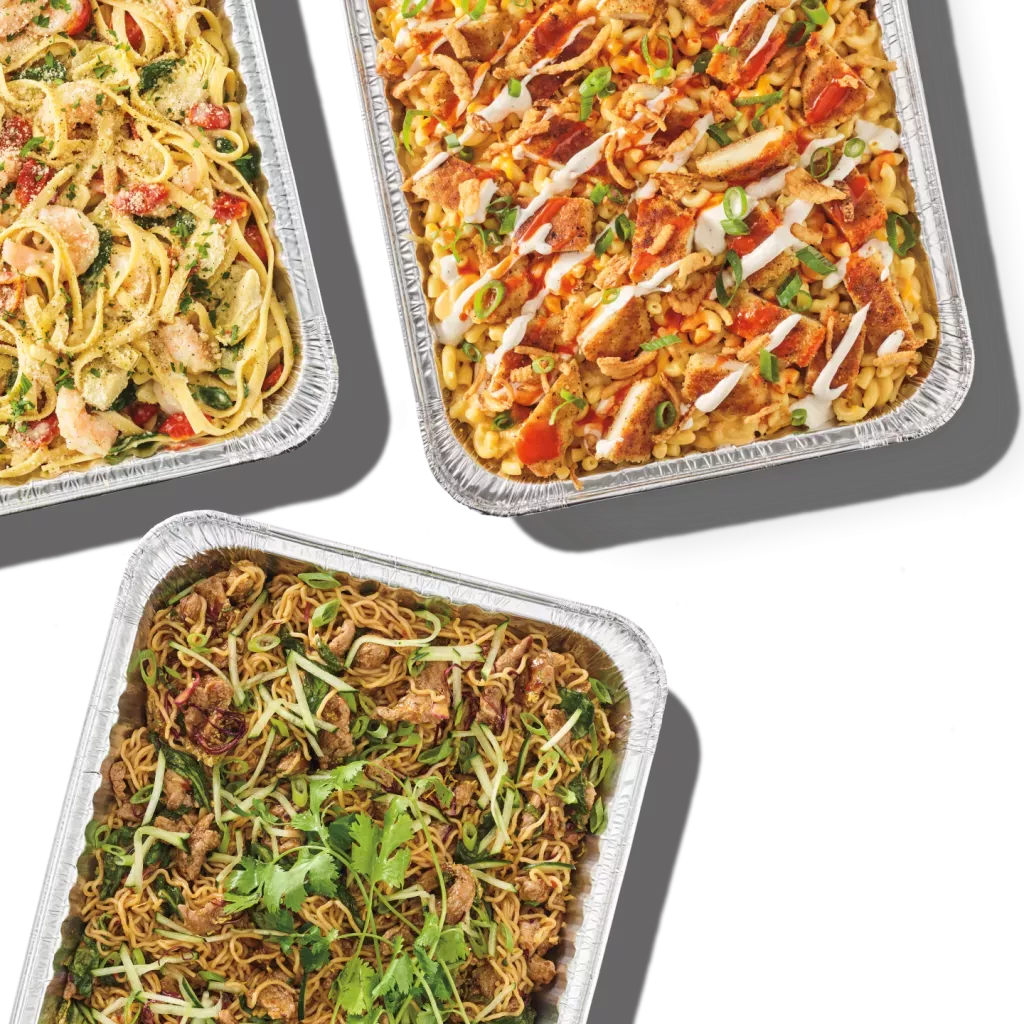 Noodles & Company catering pan offerings of Buffalo Chicken Ranch Mac, Spicy Korean Steak Noodles & Lemon Garlic Shrimp Scampi