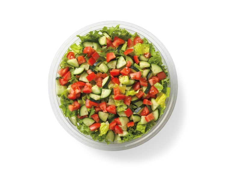 Garden Salad topped with cucumbers and tomatoes.